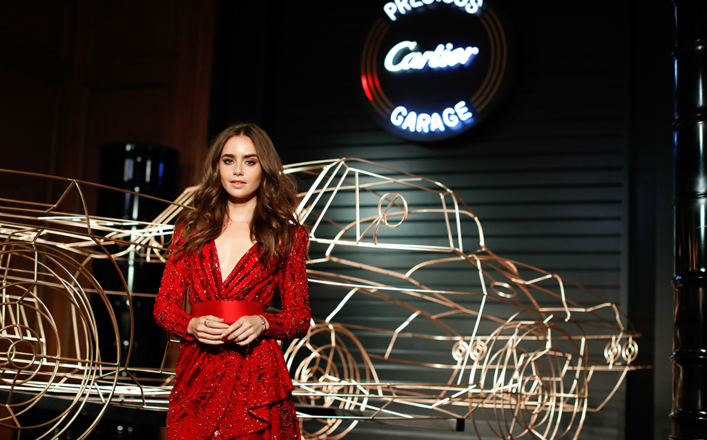 Lily Collins wearing Cartier Juste un Clou bracelet and rings