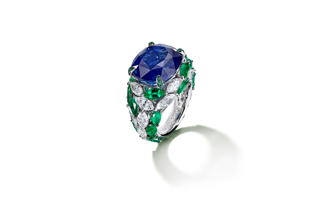 SIGNATURE: COLOUR COMBINATION: In 18K white gold set with one oval cut blue sapphire (16.89 ct), 21 marquise-cut emeralds (approx. 4.05 ct), 17 marquise-cut white diamonds (approx. 3.50 ct), 55 emeralds (approx. 0.50 ct) and 15 blue sapphires (approx. 0.04 ct).