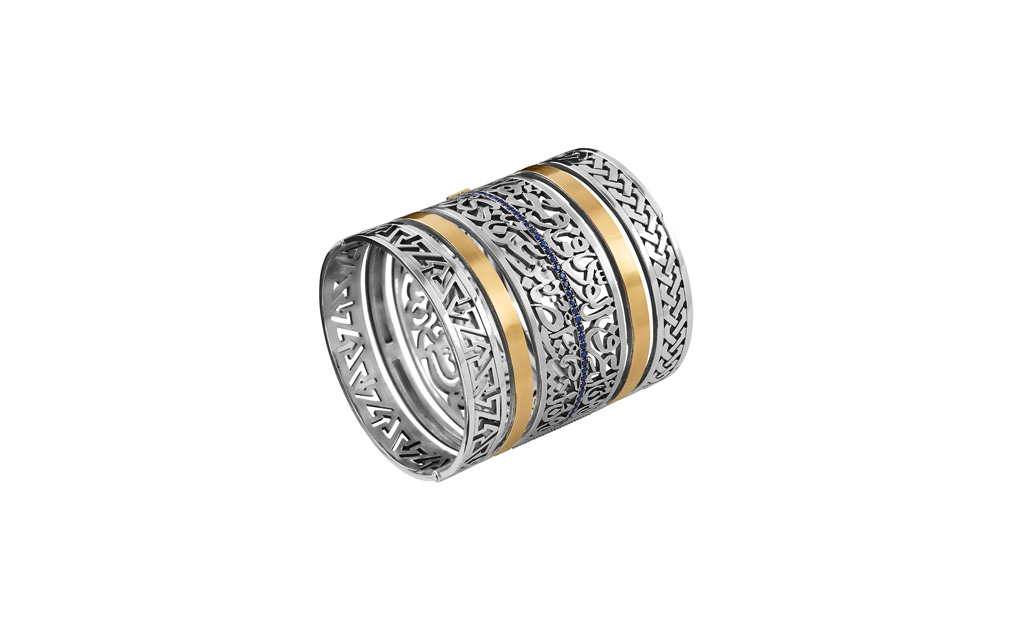 Classic cuff adorned with pave precious stones inscribed with poetry verses by Omar Ibn Abi Rab'ea in 18kt gold and sterling silver by Azza Fahmy