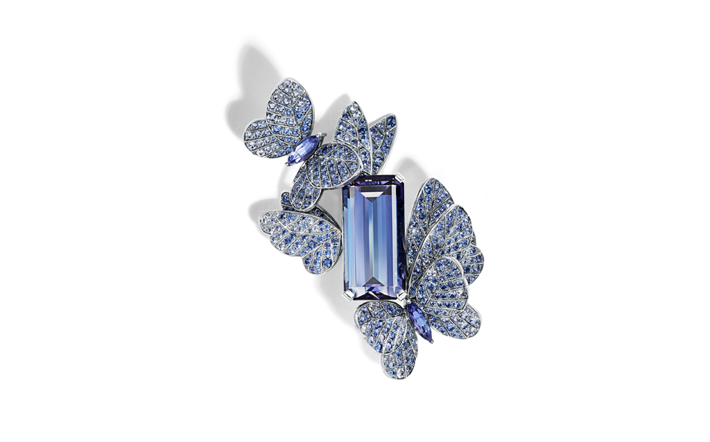 Tiffany & Co. Brooch in platinum with an emerald-cut tanzanite of over 27 carats, round and marquise sapphires, over five total carats, and round brilliant diamonds