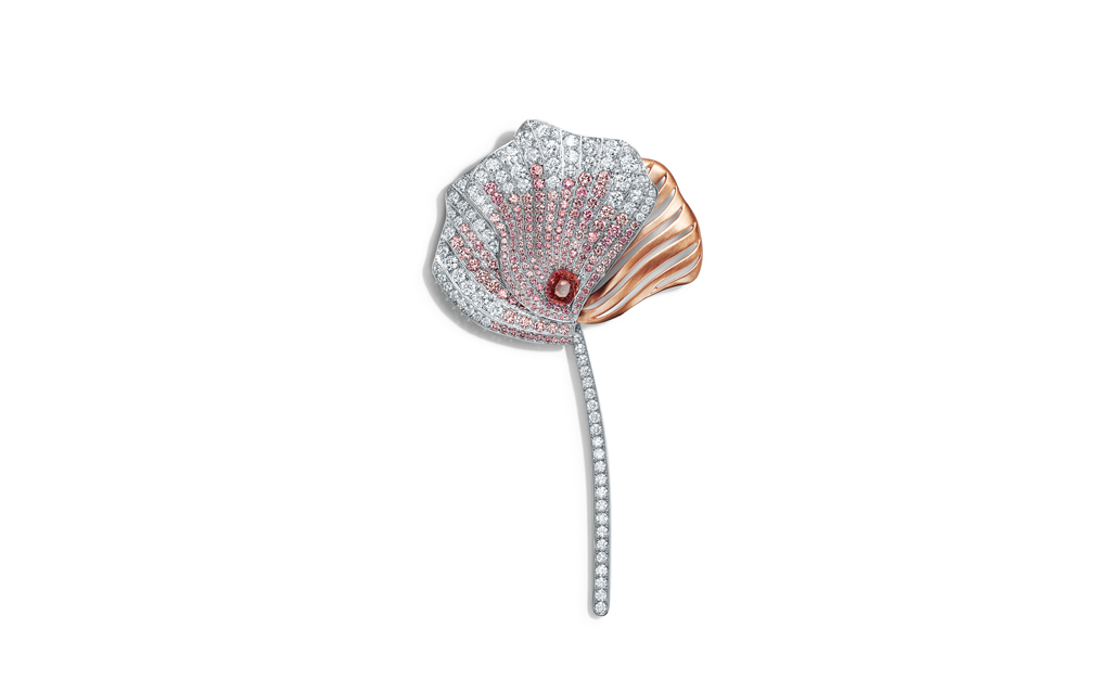 Tiffany & Co. Brooch in platinum and rose gold with an unenhanced cushion-cut orange sapphire of over three carats, round pink diamonds, over six total carats, and round brilliant diamonds