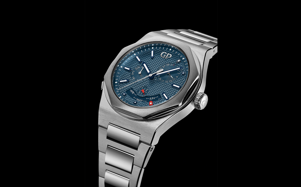 Girard-Perregaux Laureato Perpetual Calendar.  The Laureato Perpetual Calendar is the latest addition to Girard-Perregaux’s Laureato line. Carved from a 42 mm diameter steel block, alternately polished and satin-finished with the characteristic care demonstrated by the Manufacture Girard-Perregaux, it is attached to the wrist with a bracelet of the same nature, finish and quality. Its blue dial adorned with a Clous de Paris hobnail pattern, against which the white indications stand out in striki