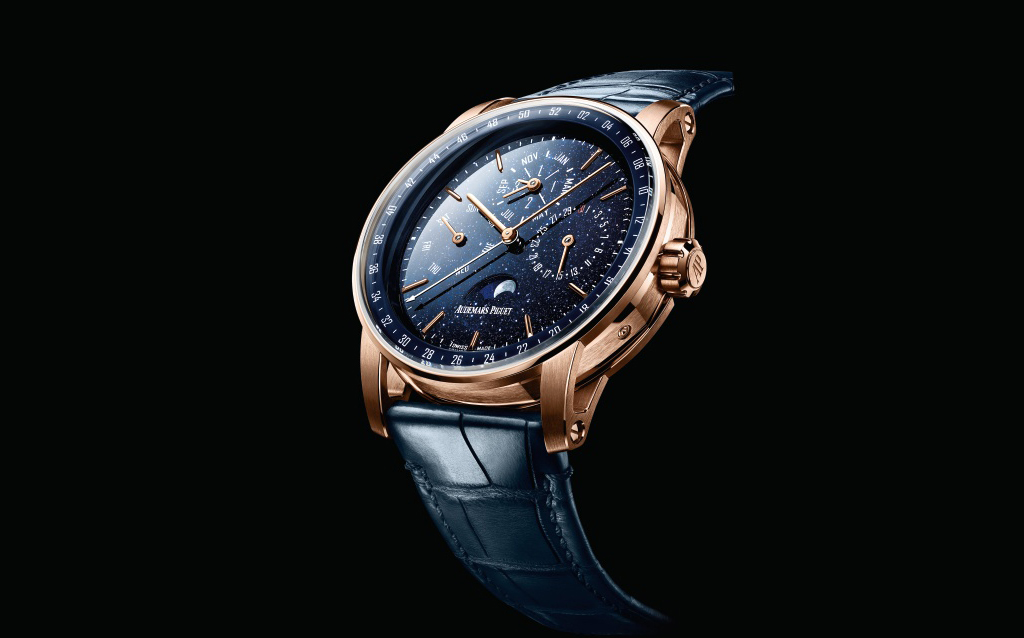 Code 11.59 Perpetual Calendar.  This watch is powered by the calibre 5134 indicating hours , minutes, moon phase and a perpetual calendar. The Code 11.59 Perpetual Calendar comes in41 mm  pink gold case  and stands out with its dark blue aventurine dial recalling a star-lit.