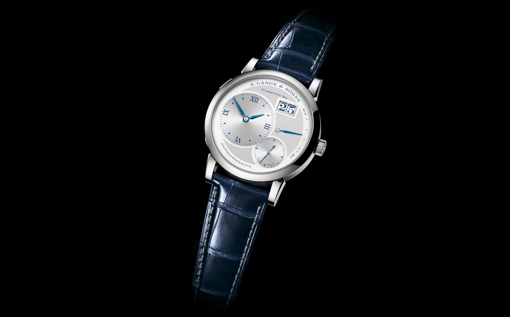 A. Lange & Söhne celebrates LANGE 1.   A. Lange & Söhne is celebrating the anniversary of the award-winning LANGE 1 watch with a “25th Anniversary” edition in white gold limited to 250 timepieces.  The LANGE 1 was the first watch of the new era and has been A. Lange & Söhne’s un-disputed icon for 25 years. Its special features include a deep-blue printed argenté dial with a re-cess, blue date numerals, a hinged cuvette with an engraving of Lange’s headquarters and a hand-engraved balance cock 
