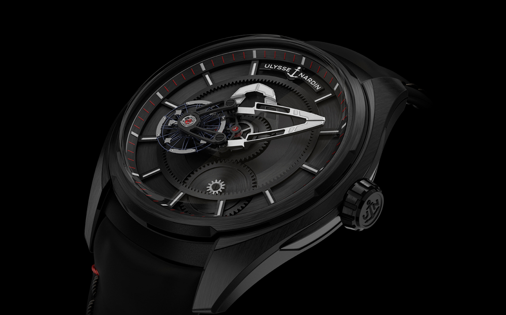 FREAK X from Ulysse Nardin.  The FREAK X from Ulysse Nardin is a new addition to the FREAK collection.. The sizing is tighter - 43mm instead of 45mm - but it is easier to read and operate. The baguette movement is a carousel, turning once on itself every hour to indicate the time. It has no dial and no hands - the central bridge acts as a minute hand and one of the wheels indicates the hours. The new FREAK X is available in titanium, rose gold, black DLC or in Carbonium ®.